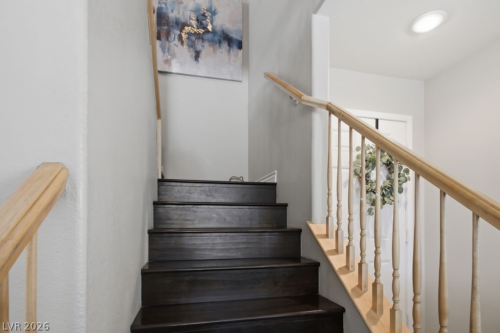 3409 Edinboro Ridge Avenue North Las Vegas, NV 89081 - Photo 17 of 51 Elegant laminate wood staircase w/ contrasting light wood railings