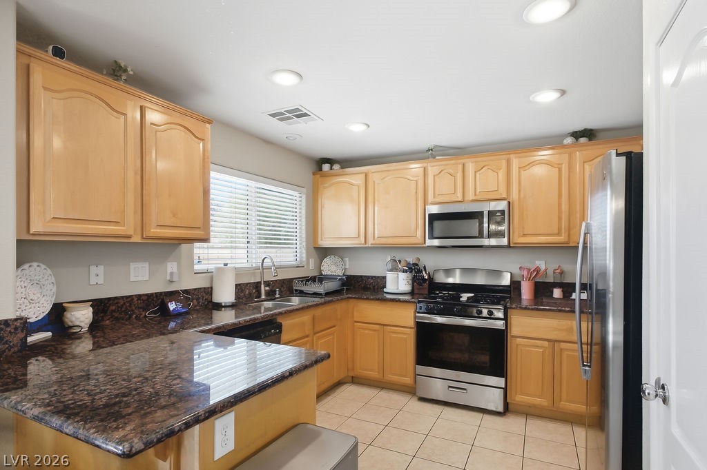 3409 Edinboro Ridge Avenue North Las Vegas, NV 89081 - Photo 47 of 51 Open kitchen floor plan w/ stainless appliances & tile flooring