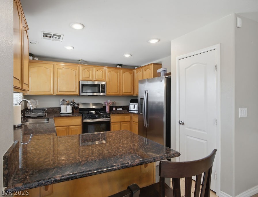 3409 Edinboro Ridge Avenue North Las Vegas, NV 89081 - Photo 2 of 51 The kitchen features recessed lighting, granite countertops and a pantry