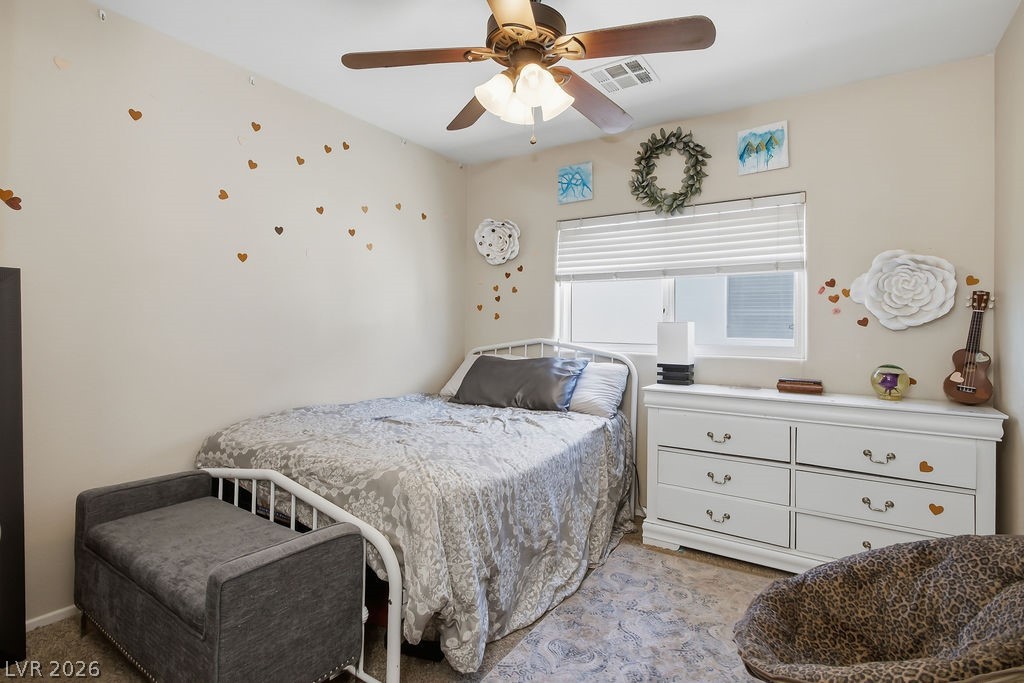 3409 Edinboro Ridge Avenue North Las Vegas, NV 89081 - Photo 32 of 51 Bedroom #2 located closest to the primary bedroom, ceiling fan & light & 2" faux wood blinds