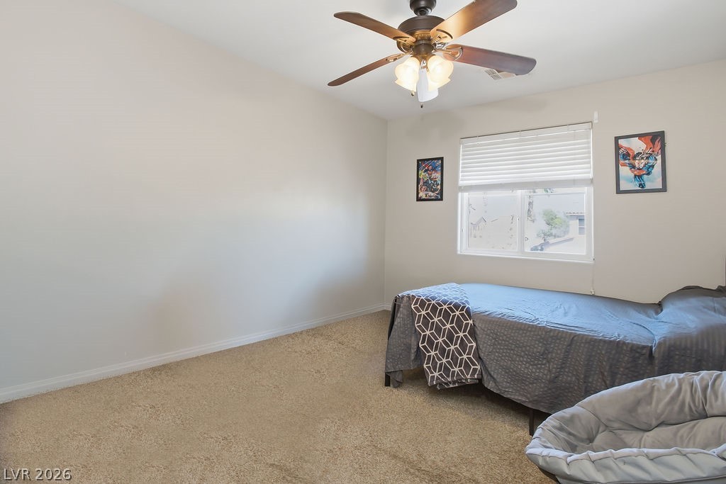 3409 Edinboro Ridge Avenue North Las Vegas, NV 89081 - Photo 33 of 51 Bedroom #3 located at opposite side of loft w/ ceiling fan & light & 2" faux wood blinds