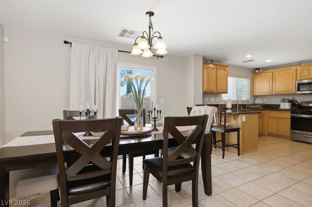 3409 Edinboro Ridge Avenue North Las Vegas, NV 89081 - Photo 4 of 51 The dining area is open to the kitchen & family room-great for entertaining