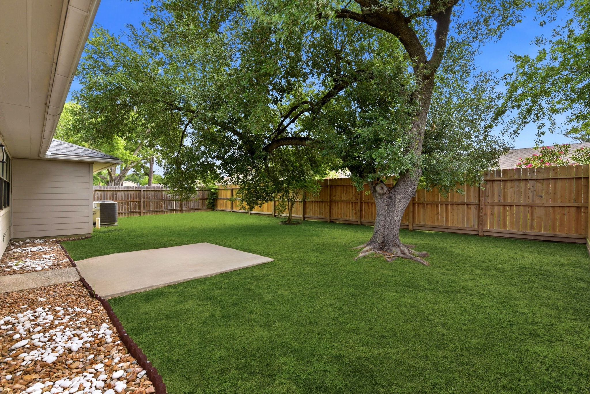 21330 Golden Dove Drive Spring, TX 77388 - Photo 26 of 29 A majestic, mature shade tree anchors the yard, providing the perfect spot to cool off during warm Texas afternoons.
