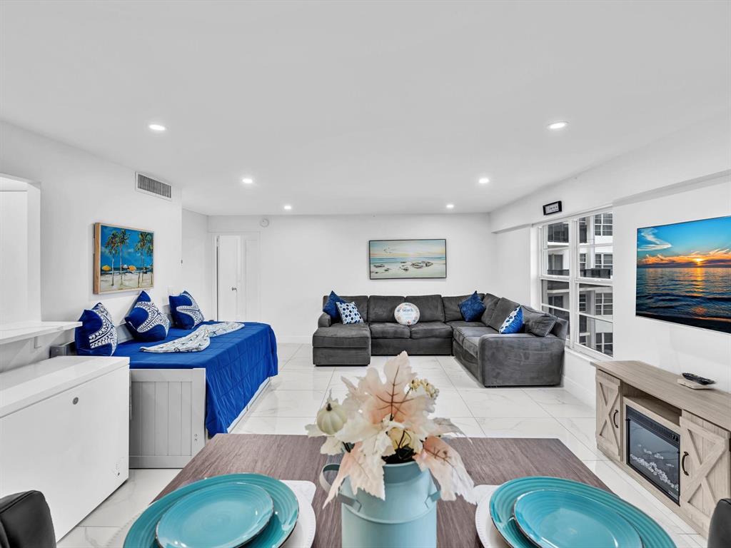 5100 Dupont Boulevard, Unit 8G Fort Lauderdale, FL 33308 - Photo 14 of 65 a living room with furniture and a flat screen tv
