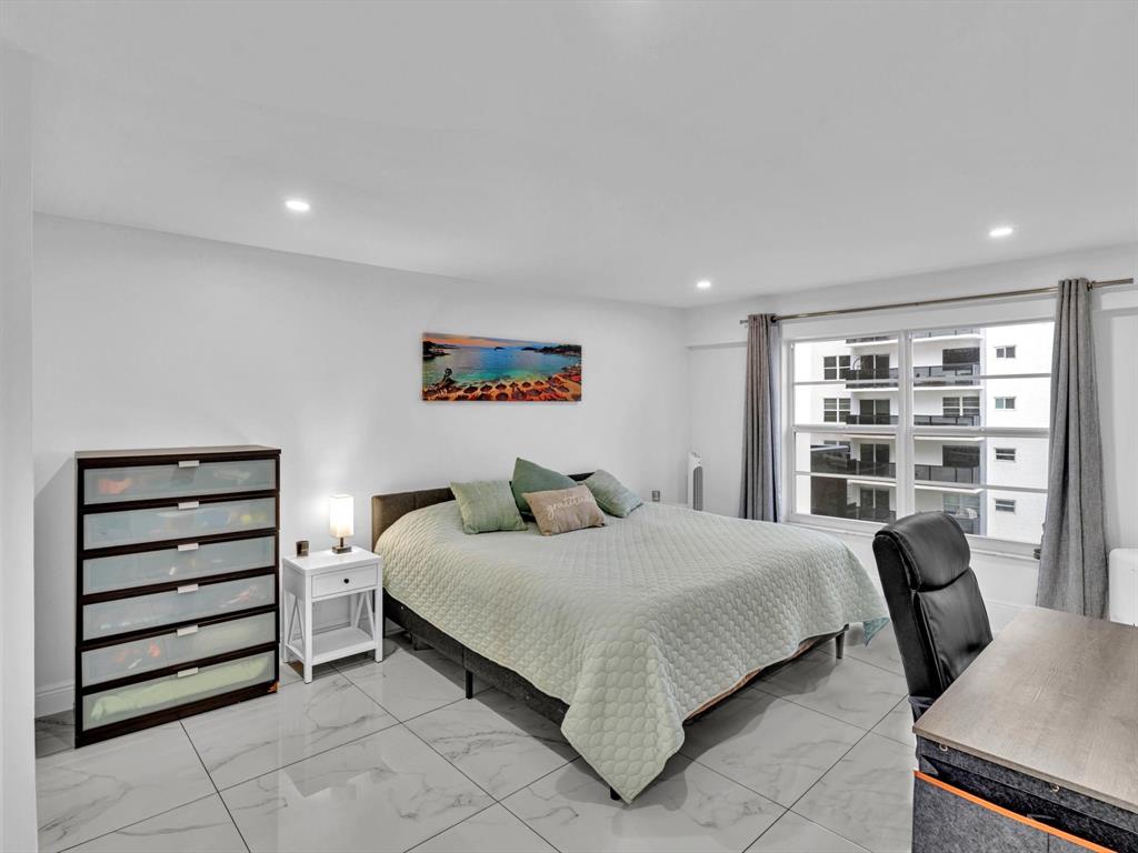 5100 Dupont Boulevard, Unit 8G Fort Lauderdale, FL 33308 - Photo 20 of 65 a bedroom with a bed and a cabinets