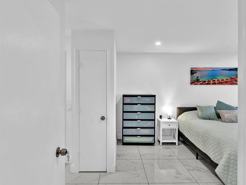 5100 Dupont Boulevard, Unit 8G Fort Lauderdale, FL 33308 - Photo 21 of 65 a bedroom with furniture and a ceiling fan