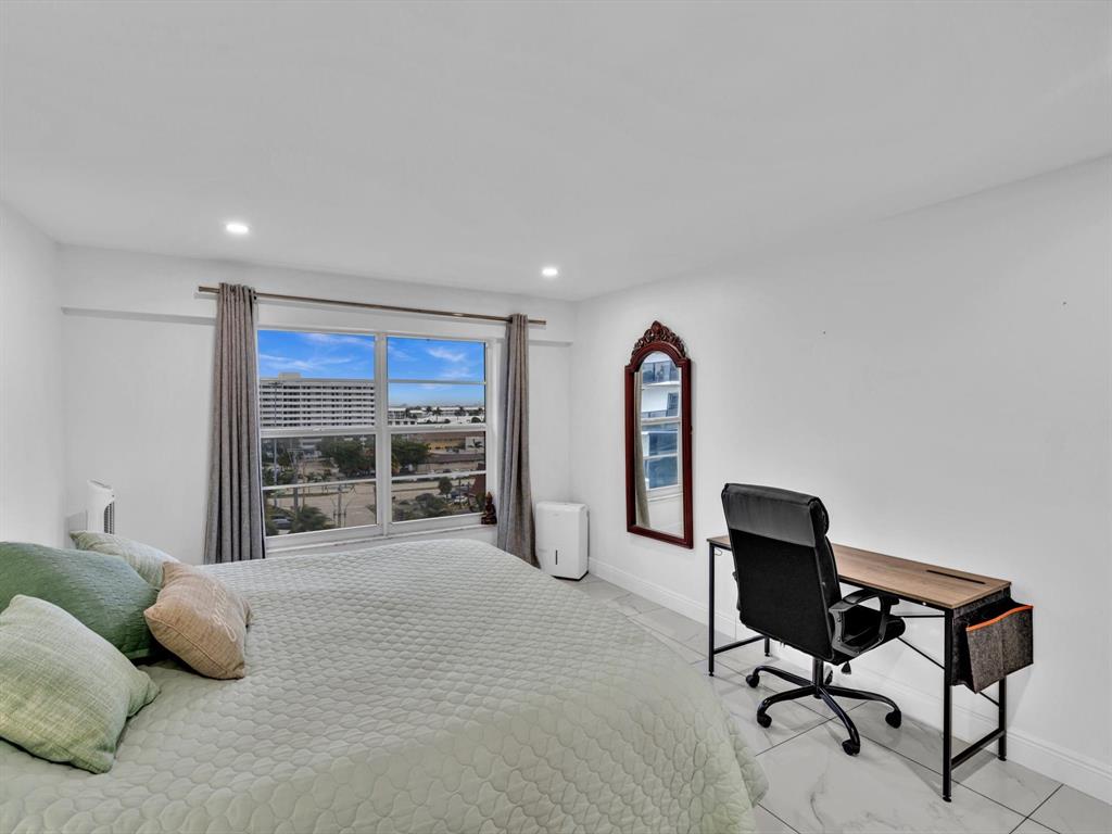 5100 Dupont Boulevard, Unit 8G Fort Lauderdale, FL 33308 - Photo 22 of 65 a bed room with a bed and a chair