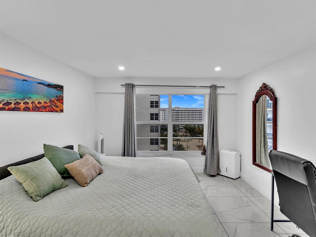 5100 Dupont Boulevard, Unit 8G Fort Lauderdale, FL 33308 - Photo 23 of 65 a bedroom with a bed and glass walk in closet