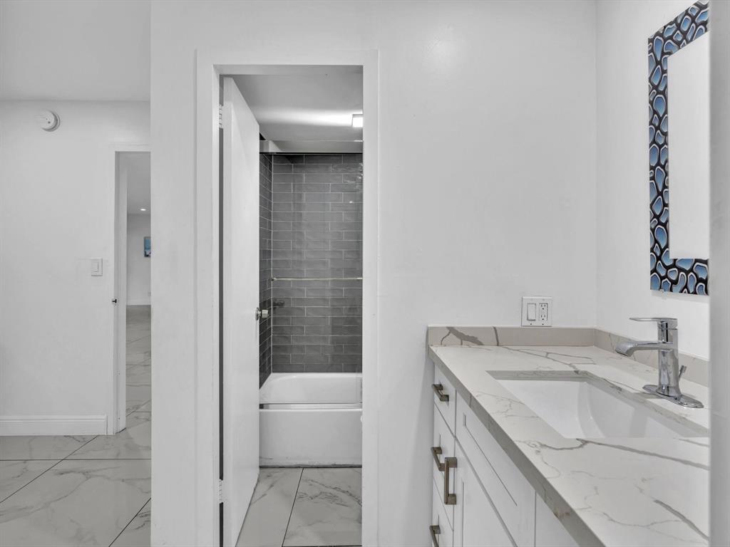 5100 Dupont Boulevard, Unit 8G Fort Lauderdale, FL 33308 - Photo 24 of 65 a bathroom with a granite countertop sink a toilet and shower