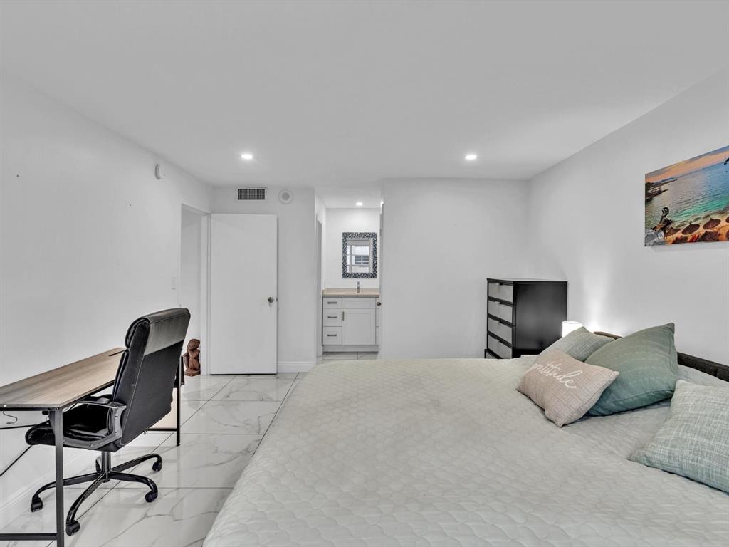 5100 Dupont Boulevard, Unit 8G Fort Lauderdale, FL 33308 - Photo 26 of 65 a bedroom with a bed a desk and chair