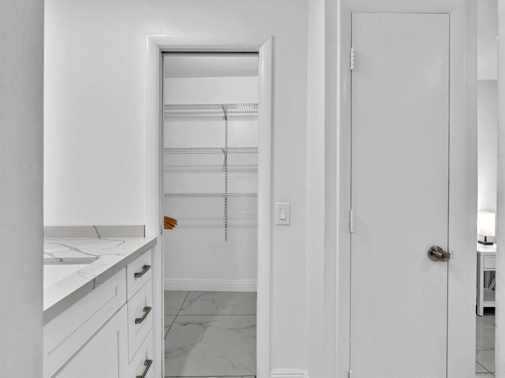 5100 Dupont Boulevard, Unit 8G Fort Lauderdale, FL 33308 - Photo 27 of 65 a view of cabinets and utility room