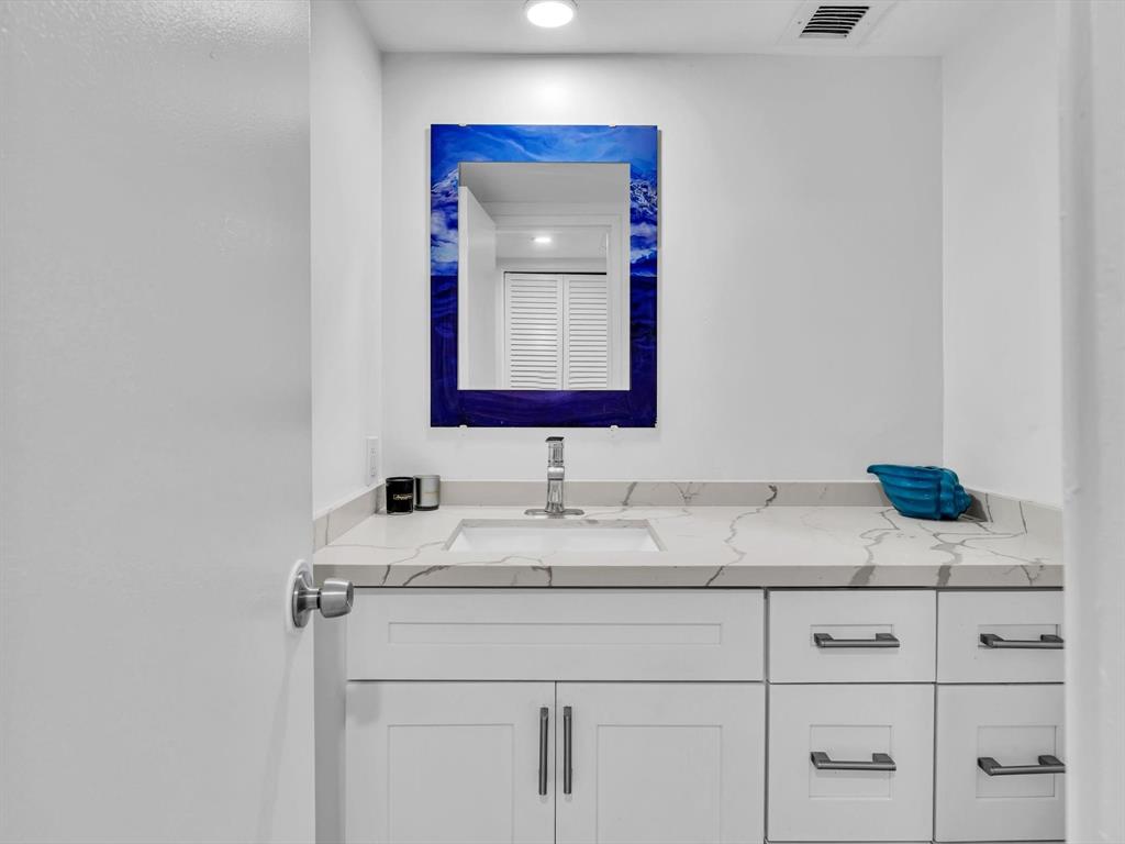 5100 Dupont Boulevard, Unit 8G Fort Lauderdale, FL 33308 - Photo 30 of 65 a bathroom with a sink and a mirror