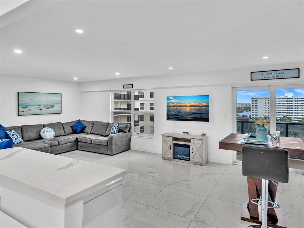 5100 Dupont Boulevard, Unit 8G Fort Lauderdale, FL 33308 - Photo 3 of 65 a living room with furniture and a flat screen tv