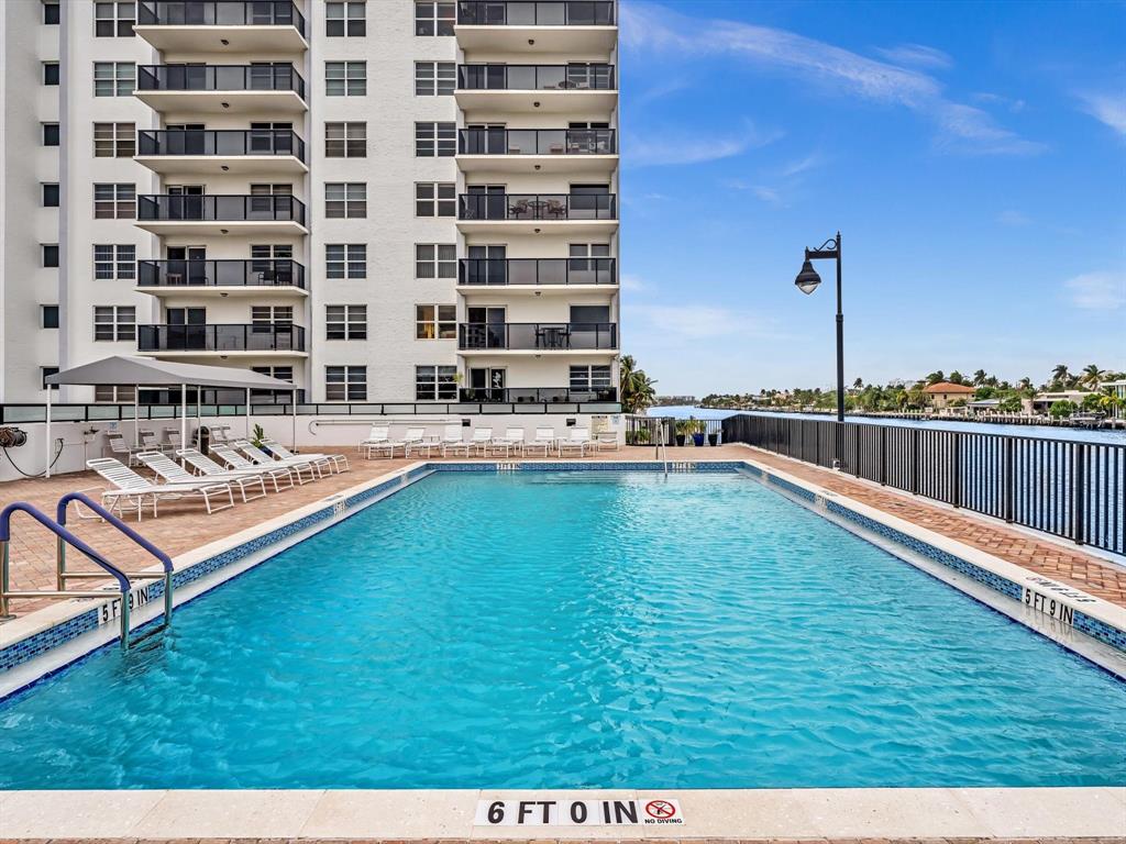 5100 Dupont Boulevard, Unit 8G Fort Lauderdale, FL 33308 - Photo 39 of 65 a swimming pool with outdoor seating and yard