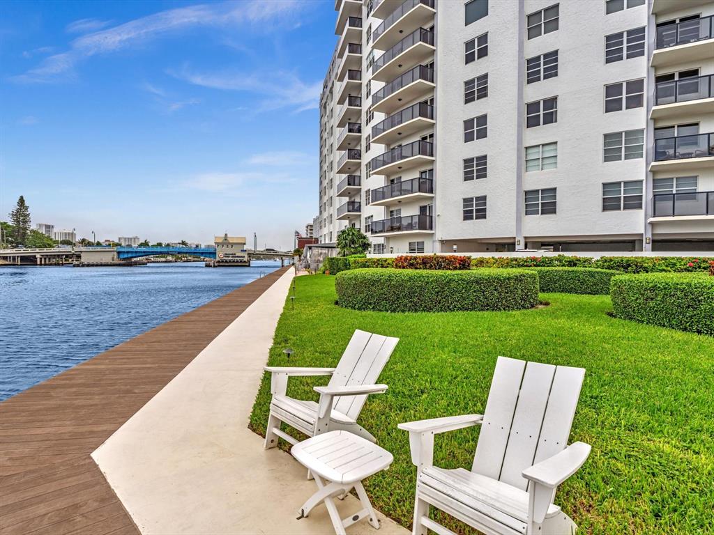 5100 Dupont Boulevard, Unit 8G Fort Lauderdale, FL 33308 - Photo 44 of 65 a view of a chair and table on the garden