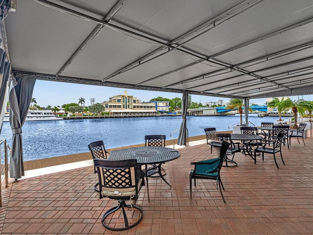 5100 Dupont Boulevard, Unit 8G Fort Lauderdale, FL 33308 - Photo 45 of 65 a view of a chairs and table in a patio