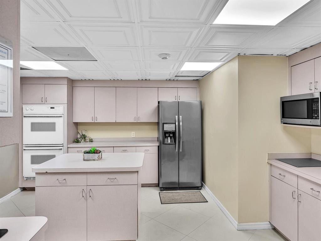 5100 Dupont Boulevard, Unit 8G Fort Lauderdale, FL 33308 - Photo 47 of 65 a kitchen with a sink stainless steel appliances and cabinets