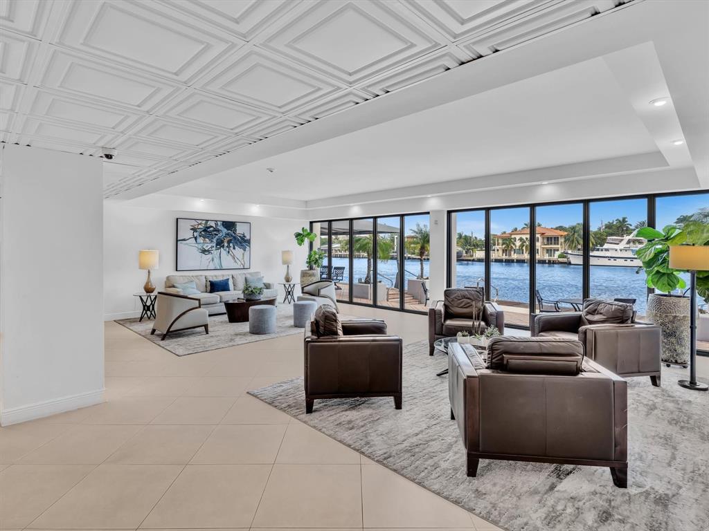 5100 Dupont Boulevard, Unit 8G Fort Lauderdale, FL 33308 - Photo 49 of 65 a living room with furniture and a floor to ceiling window