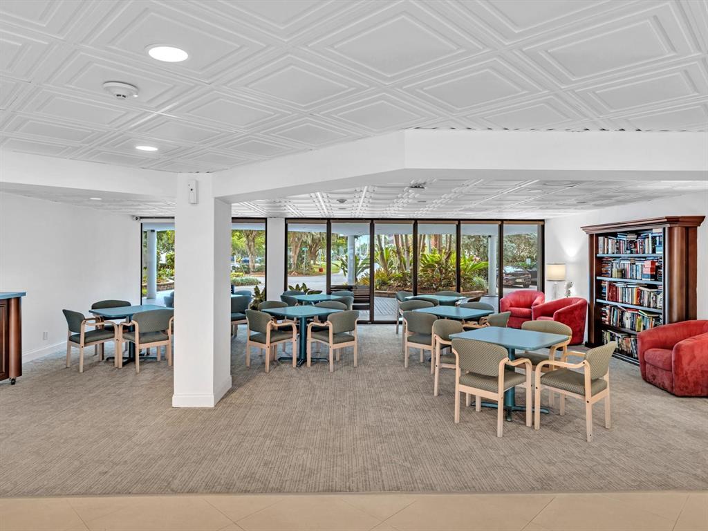 5100 Dupont Boulevard, Unit 8G Fort Lauderdale, FL 33308 - Photo 54 of 65 a living room with furniture a window and a table