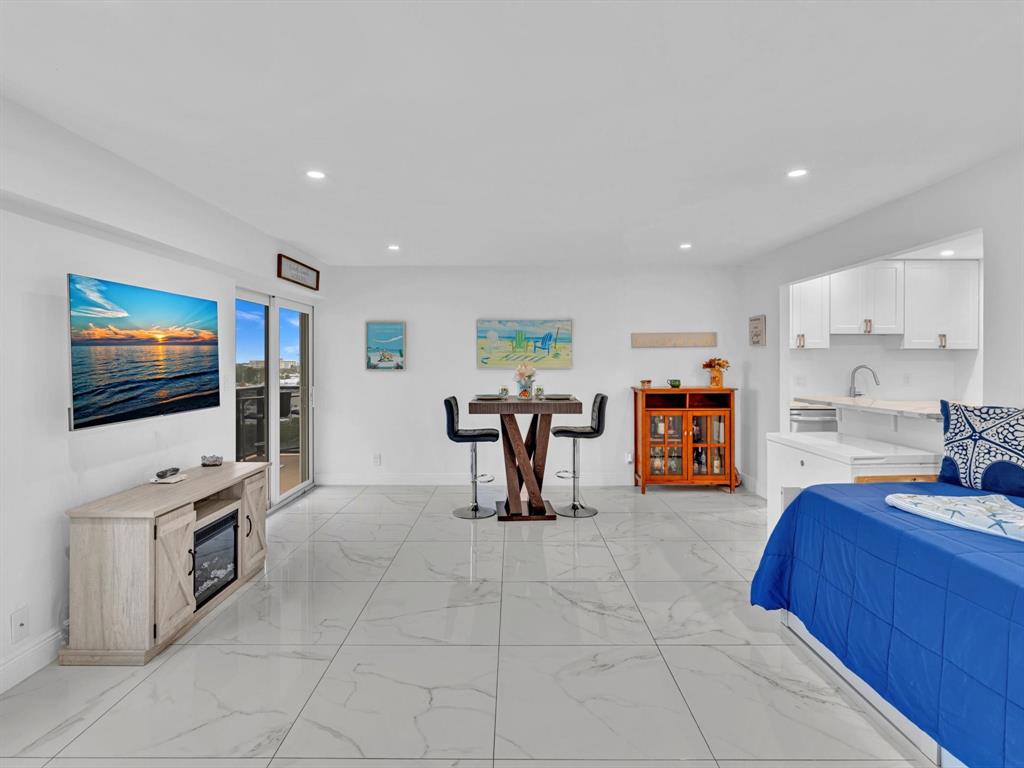 5100 Dupont Boulevard, Unit 8G Fort Lauderdale, FL 33308 - Photo 6 of 65 a living room with furniture and a flat screen tv