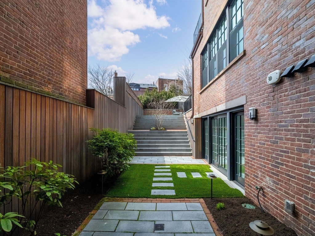 5 Joy Street, Unit 1 Boston, MA 02108 - Photo 17 of 32 a view of a house with a garden