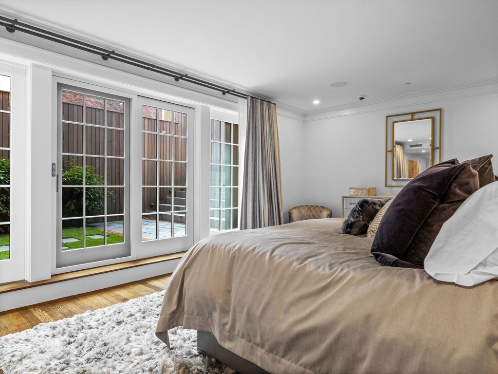 5 Joy Street, Unit 1 Boston, MA 02108 - Photo 18 of 32 a bedroom with a bed and a window