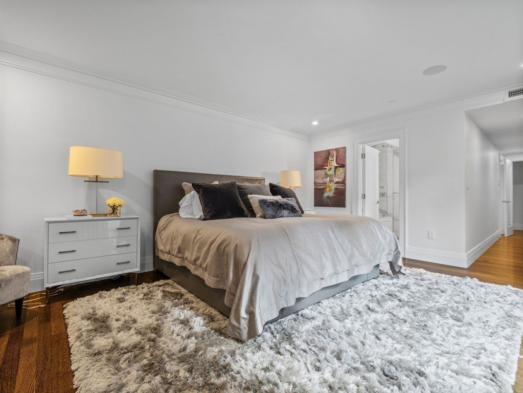 5 Joy Street, Unit 1 Boston, MA 02108 - Photo 20 of 32 a bedroom with a bed and lamp