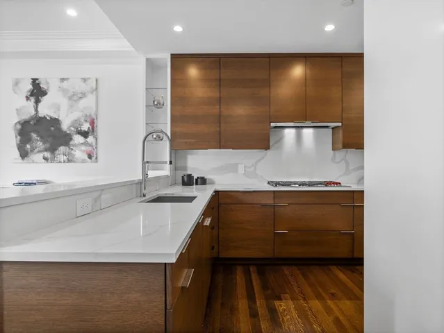 a kitchen with a sink and a refrigerator