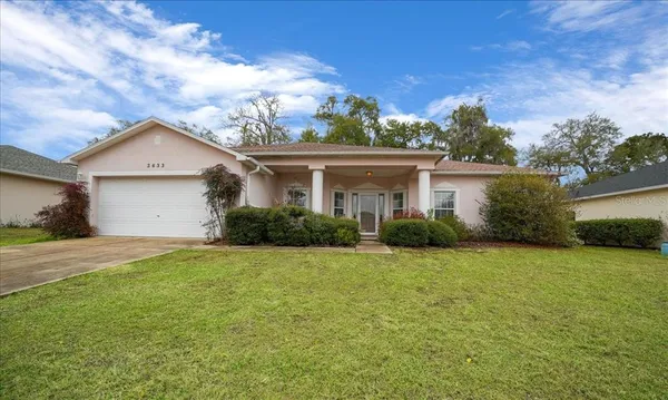 front view of a house with a yard
