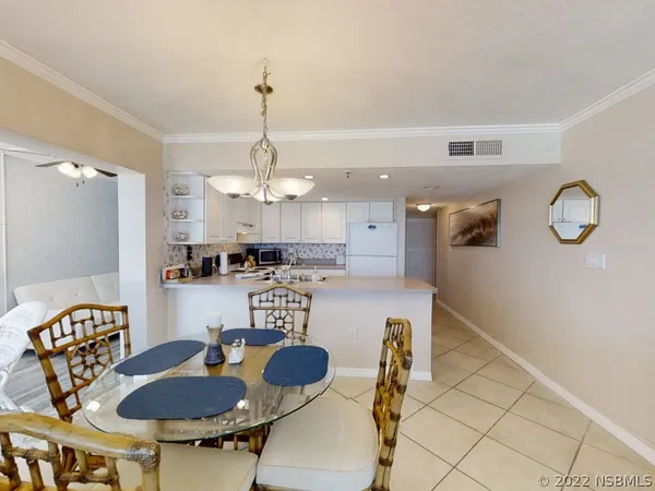 a view of dining room with washer and dryer