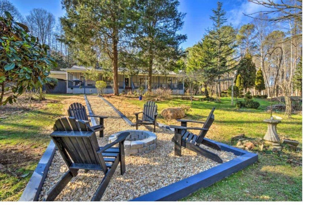 a view of a swimming pool with a patio and a yard