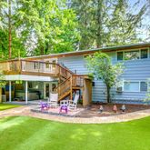 a view of a house with a yard patio and swimming pool