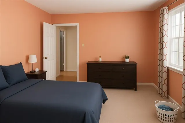 a bedroom with a bed and a dresser