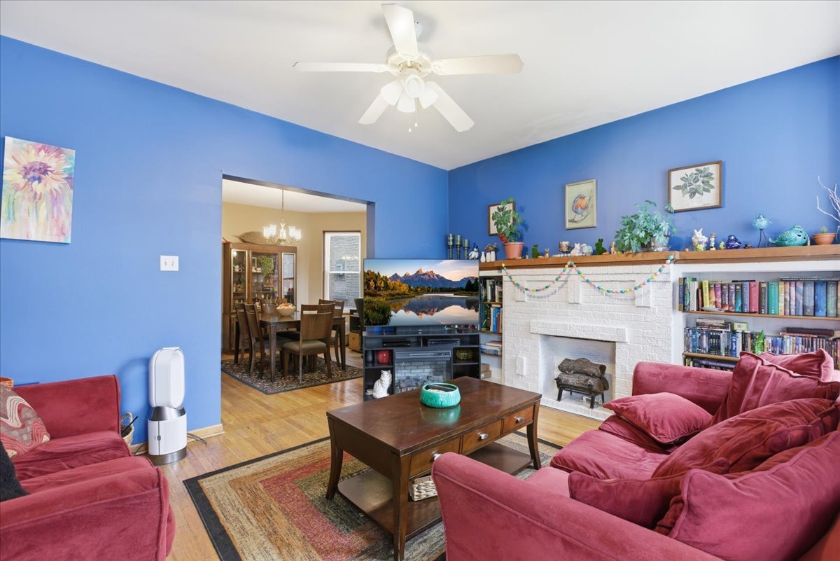 2318 West Addison Street Chicago, IL 60618 - Photo 16 of 31 a living room with furniture and a fireplace