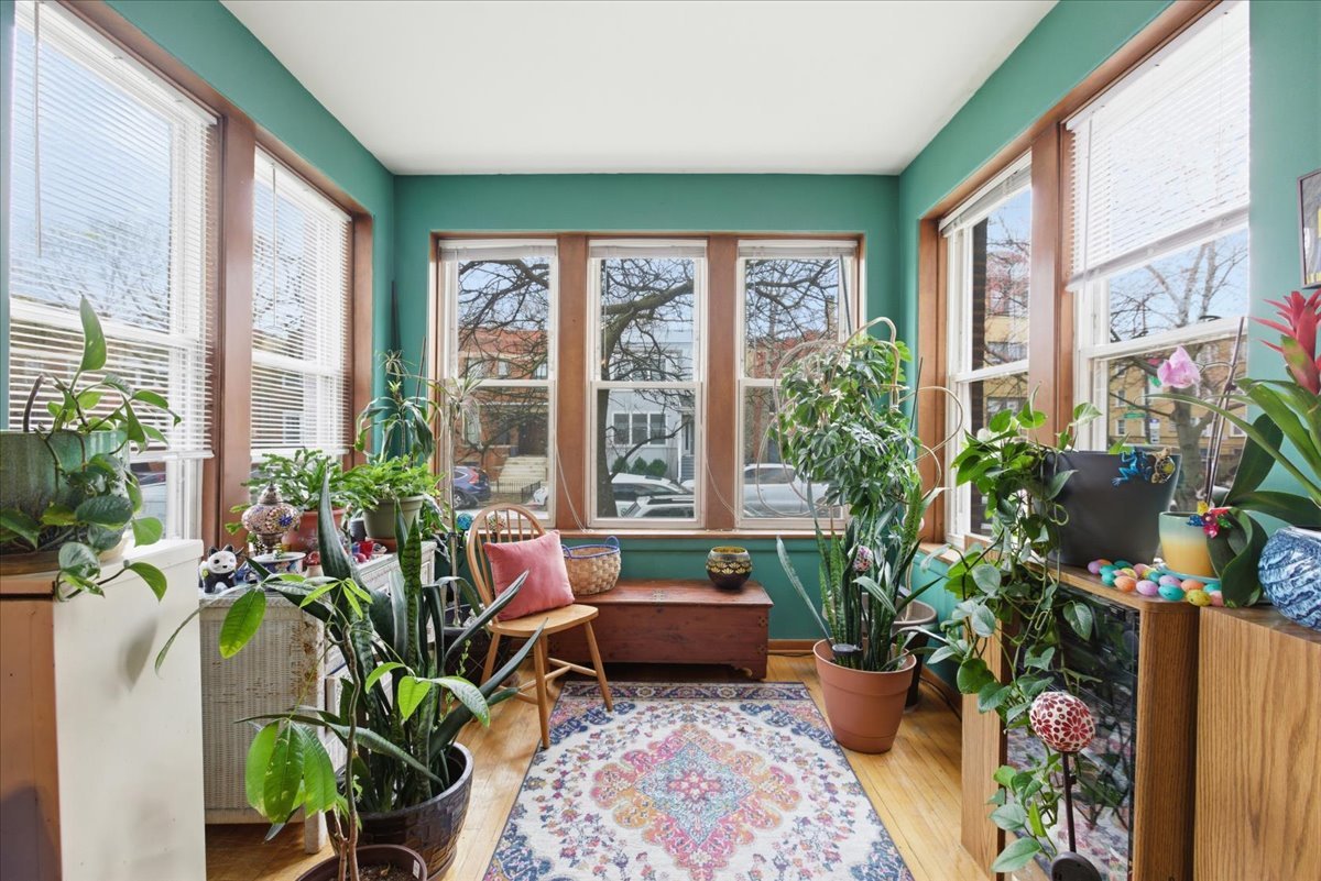 2318 West Addison Street Chicago, IL 60618 - Photo 17 of 31 a living room filled with furniture and a potted plant