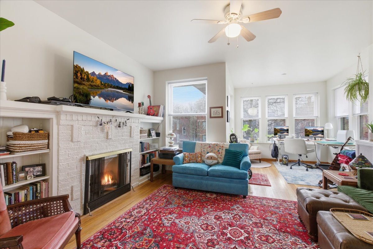 2318 West Addison Street Chicago, IL 60618 - Photo 2 of 31 a living room with furniture fireplace and a window