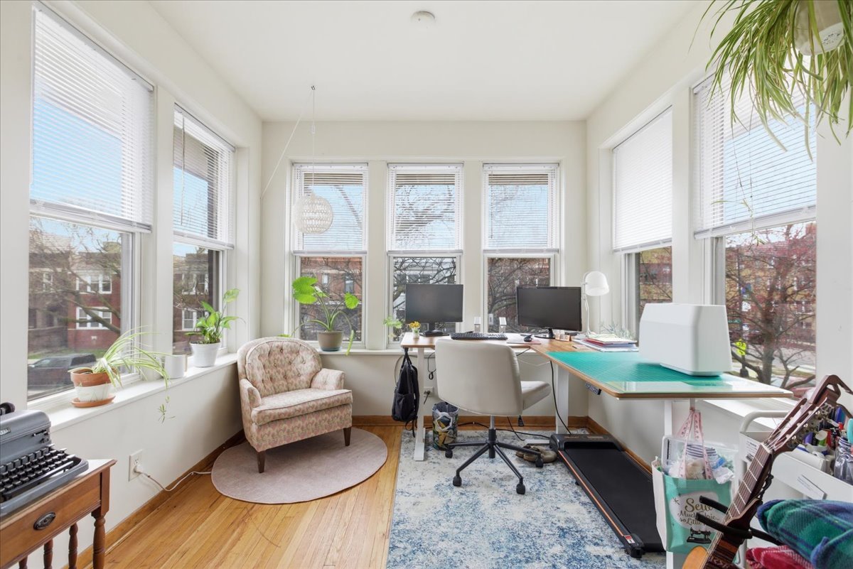 2318 West Addison Street Chicago, IL 60618 - Photo 4 of 31 a living room with furniture and a large window