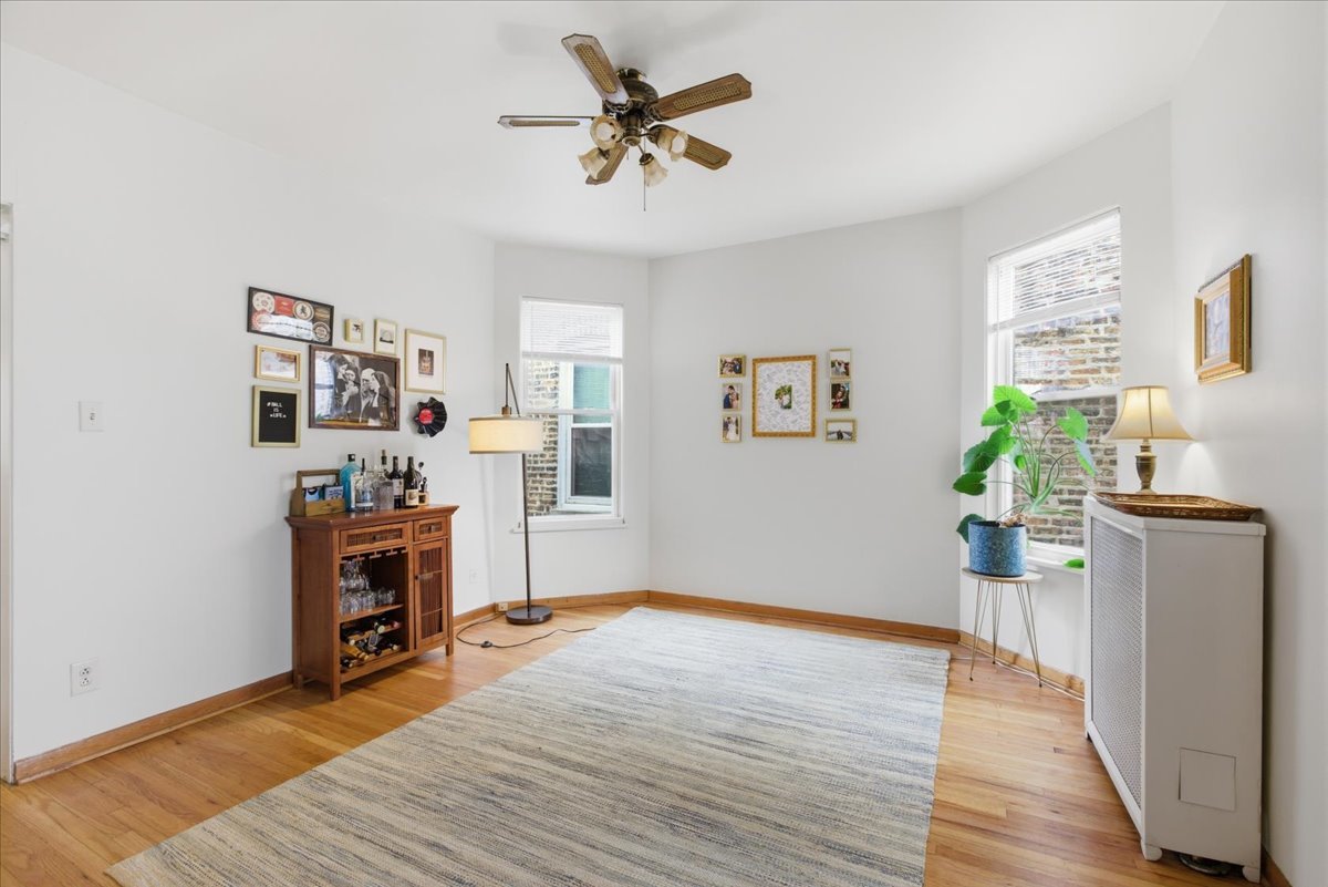 2318 West Addison Street Chicago, IL 60618 - Photo 6 of 31 a living room with furniture and a wooden floor