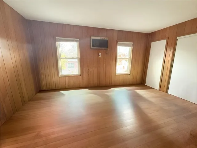 a view of a room with wooden floor and stairs