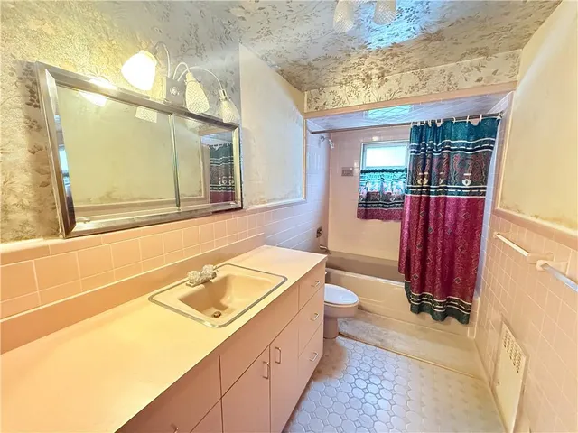 a view of a bathroom with shower