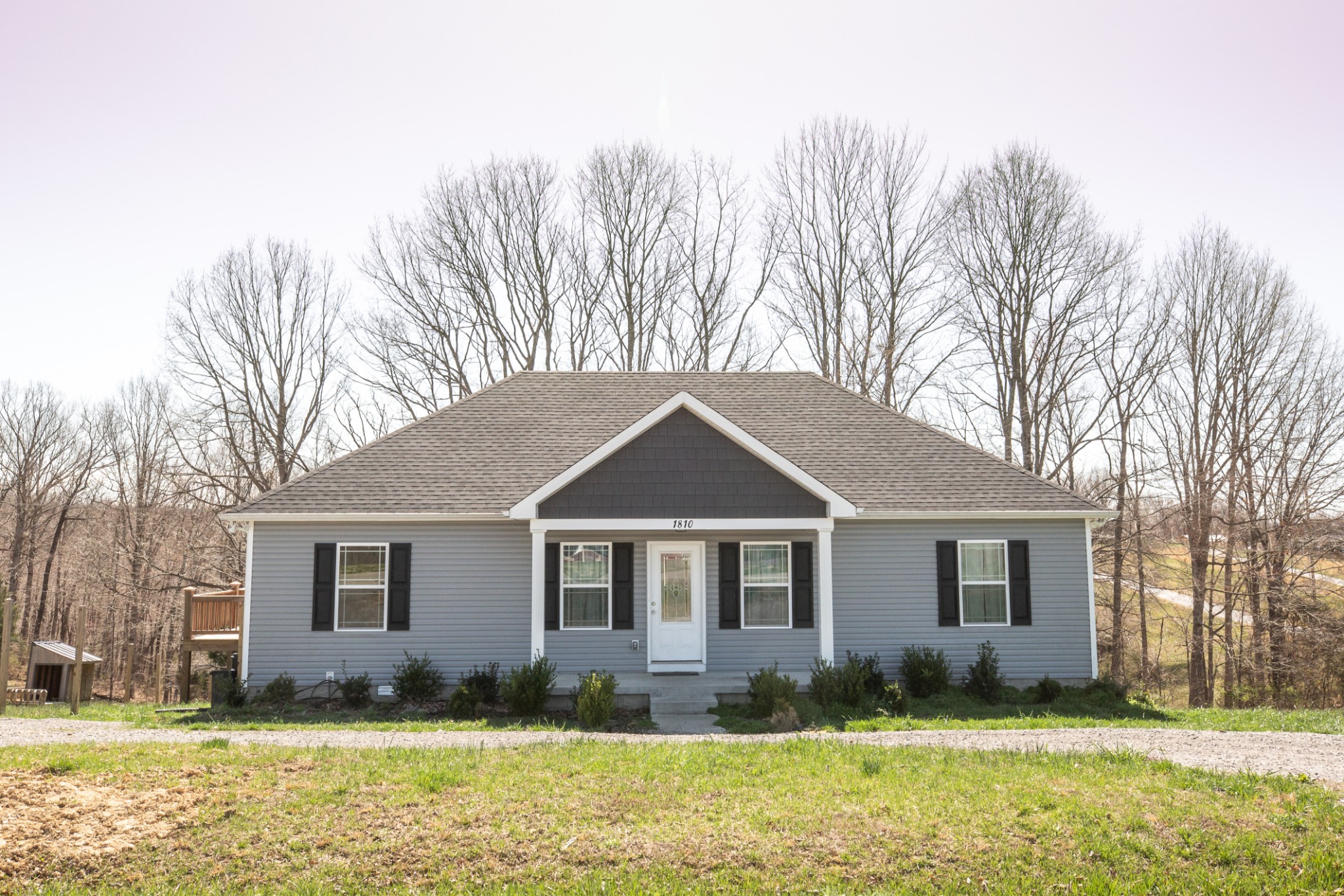 1810 Holland Road Lafayette, TN 37083 - Photo 1 of 10 a front view of a house with a yard