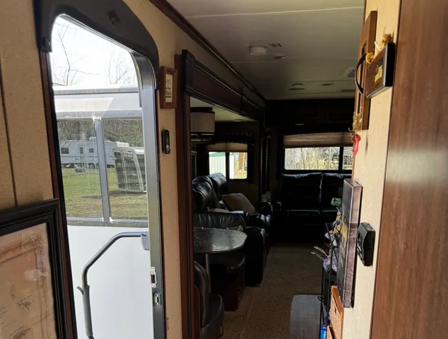 a bedroom with a bed a mirror and dresser