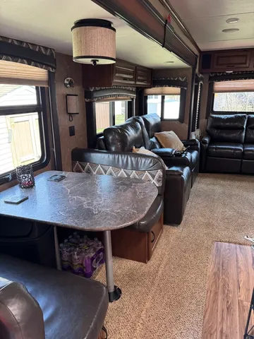 a view of a livingroom with furniture and window
