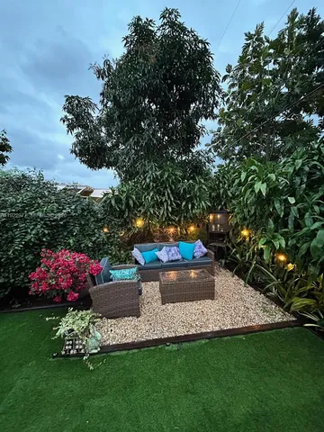 a view of a garden with flowers and plants