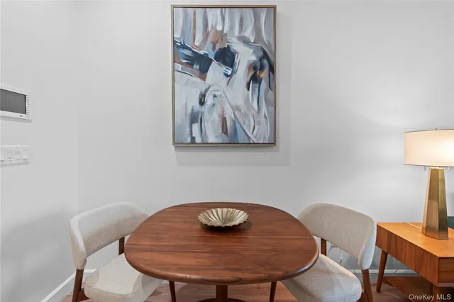 a view of a room that has a table and chairs in it