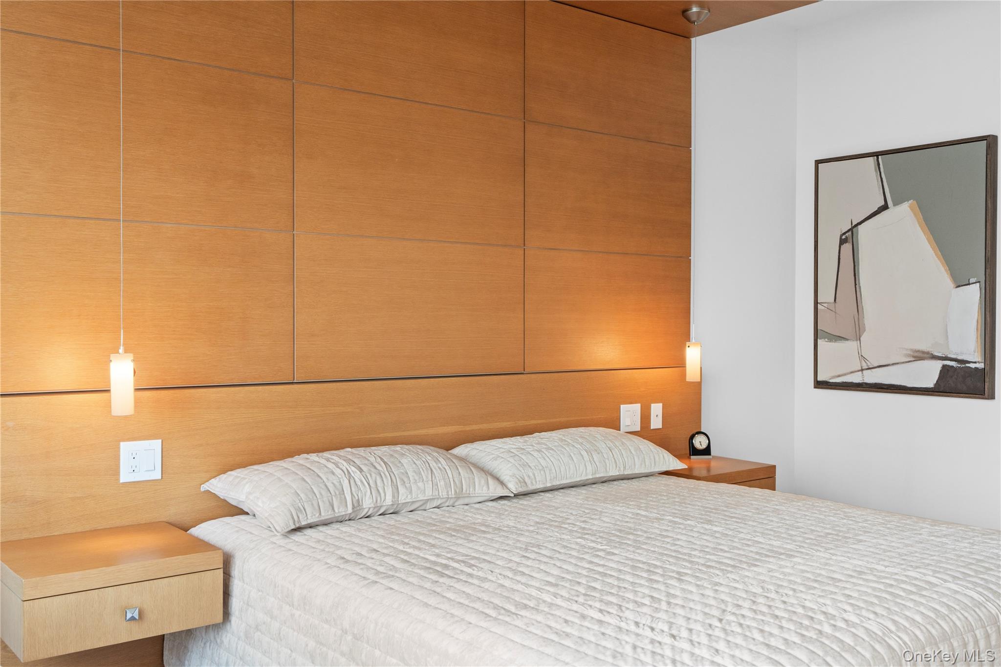 1 Renaissance Square, Unit 10B White Plains, NY 10601 - Photo 25 of 36 a bedroom with a bed and a couch