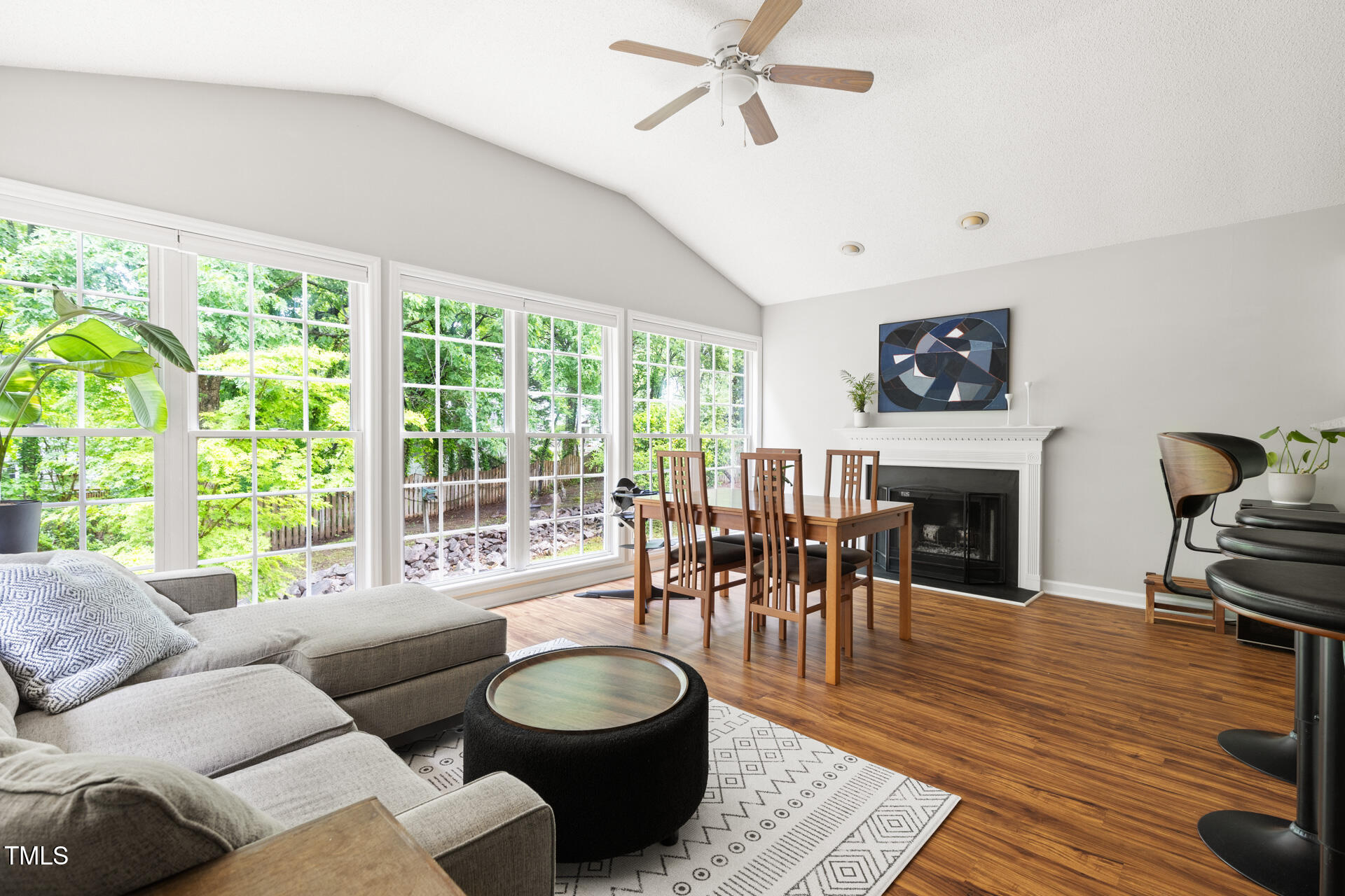 2301 Bolingbrook Lane Raleigh, NC 27613 - Photo 15 of 36 a living room with furniture and a floor to ceiling window