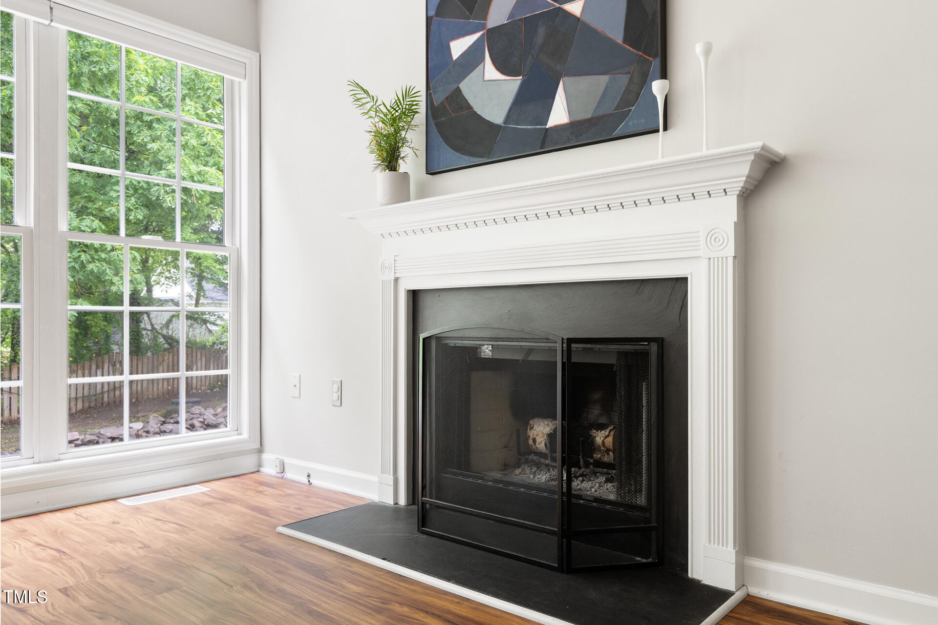 2301 Bolingbrook Lane Raleigh, NC 27613 - Photo 16 of 36 a view of an empty room with wooden floor and a window