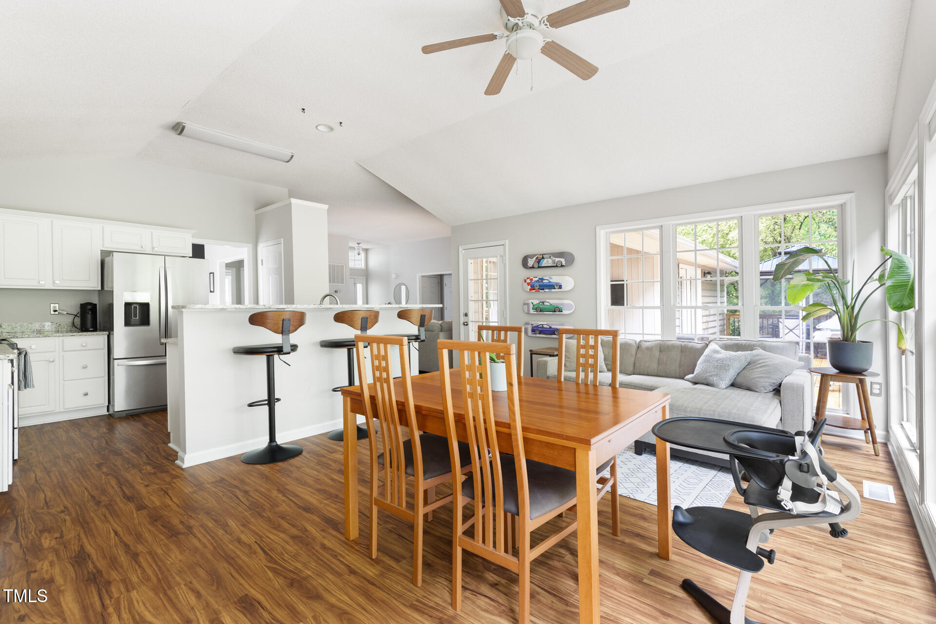 2301 Bolingbrook Lane Raleigh, NC 27613 - Photo 17 of 36 a dining room with furniture and wooden floor
