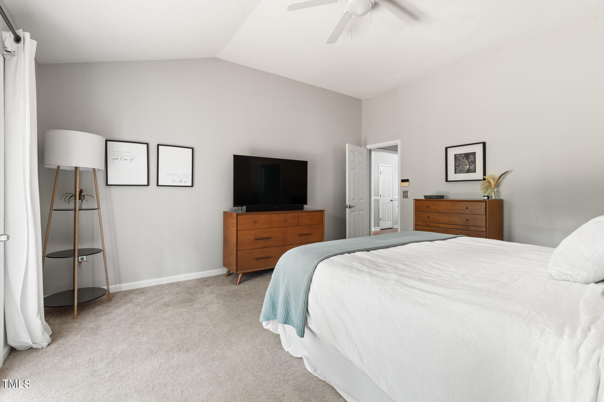 2301 Bolingbrook Lane Raleigh, NC 27613 - Photo 22 of 36 a bedroom with a bed and a flat screen tv